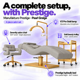 Manufakturo Prestige Pearl Greige four-piece salon set features: hydraulic bed, Serenity chair, V3 Pro Gold lamp and gold trolley.