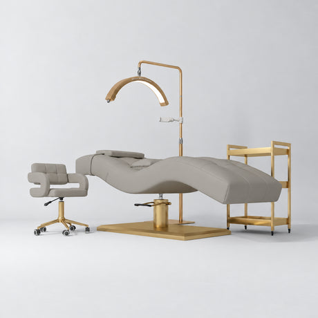 Manufakturo Prestige Pearl Greige studio set with hydraulic lash bed, Serenity chair, V3 Pro Gold lamp and empty gold trolley.