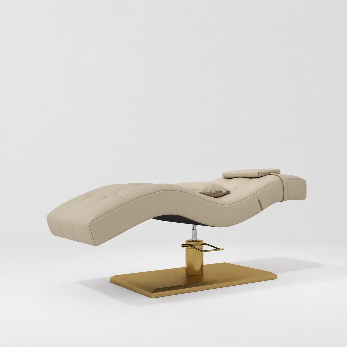 Manufakturo Prestige Warm Beige hydraulic eyelash bed, three-quarter side view with gold pedestal base and contoured upholstery.