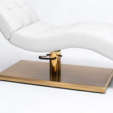 Manufakturo Prestige White upholstered bed close-up with gold hydraulic pump, black foot pedal and rectangular gold base.