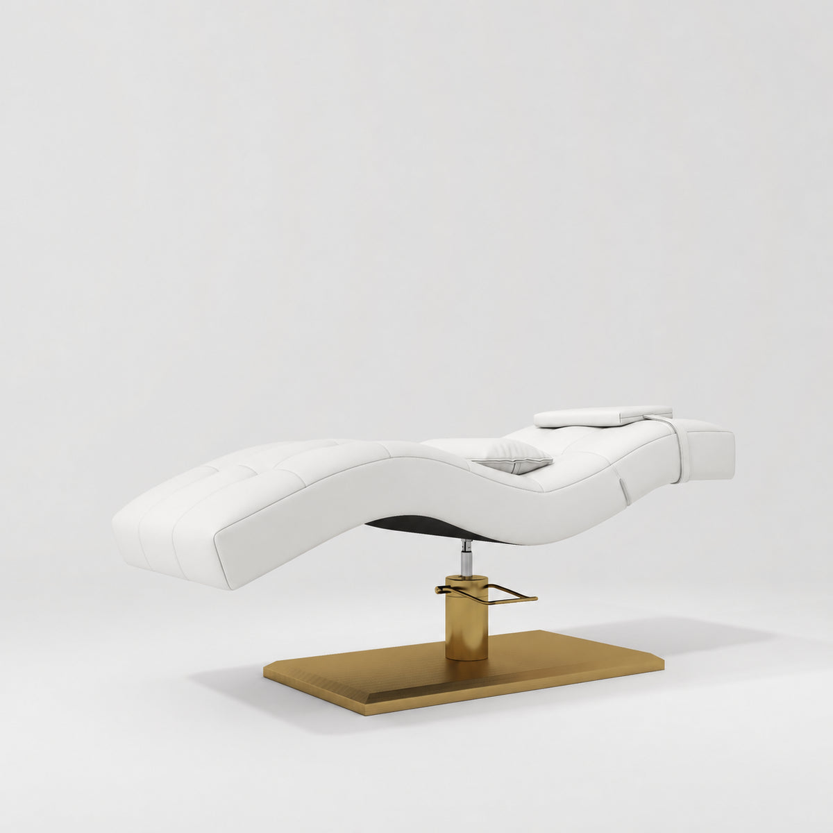 Manufakturo Prestige White hydraulic eyelash bed, three-quarter side view with gold pedestal base and contoured upholstery.