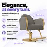 Manufakturo Regency Deep Ash styling chair with foot-operated hydraulic height adjustment, swivel and locking control, padded armrests, integrated metal footrest, curved backrest and gold-finished base.