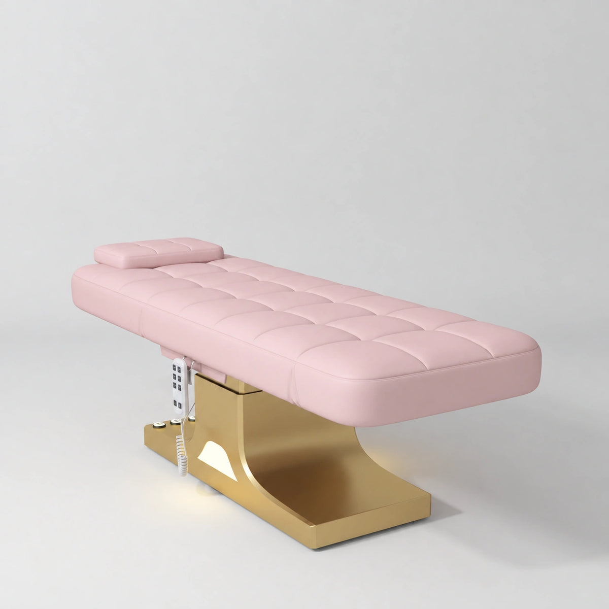 Manufakturo Saphir A Bare Blush electric beauty bed with gold base, flat lying position shown in a three-quarter view, without armrests.