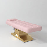 Manufakturo Saphir A Bare Blush electric beauty bed with gold base, flat lying position shown in a three-quarter view, without armrests.