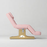 Manufakturo Saphir A Bare Blush electric beauty bed with gold base, raised treatment position shown from the side, without armrests.