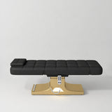 Manufakturo Saphir A Black electric beauty bed with gold base, flat lying position shown from the side, without armrests.
