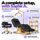 Manufakturo Saphir A Black set features: three-motor bed with hand and foot controls, Serenity swivel chair, adjustable V3 Pro Gold lamp and three-tier gold trolley.