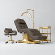 Manufakturo Saphir A Cocoa Mocha four-piece beauty studio set with electric bed, Serenity salon chair, V3 Pro Gold lamp and empty three-tier gold trolley.