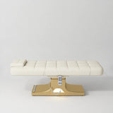 Manufakturo Saphir A Creamy electric beauty bed with gold base, flat lying position shown from the side, without armrests.
