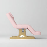 Manufakturo Saphir A Light Pink electric beauty bed with gold base, raised treatment position shown from the side, without armrests.