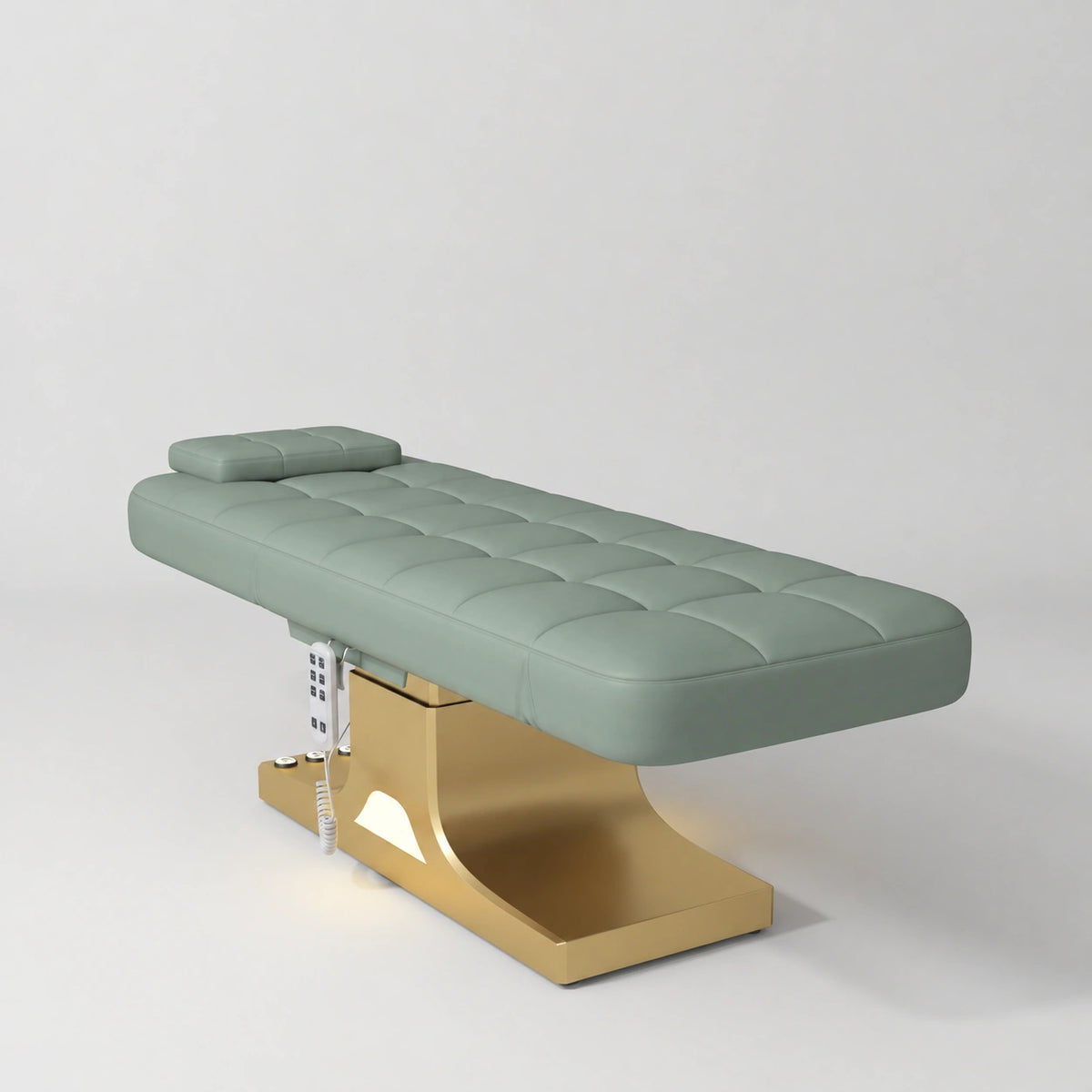 Manufakturo Saphir A Olive electric beauty bed with gold base, flat lying position shown in a three-quarter view, without armrests.