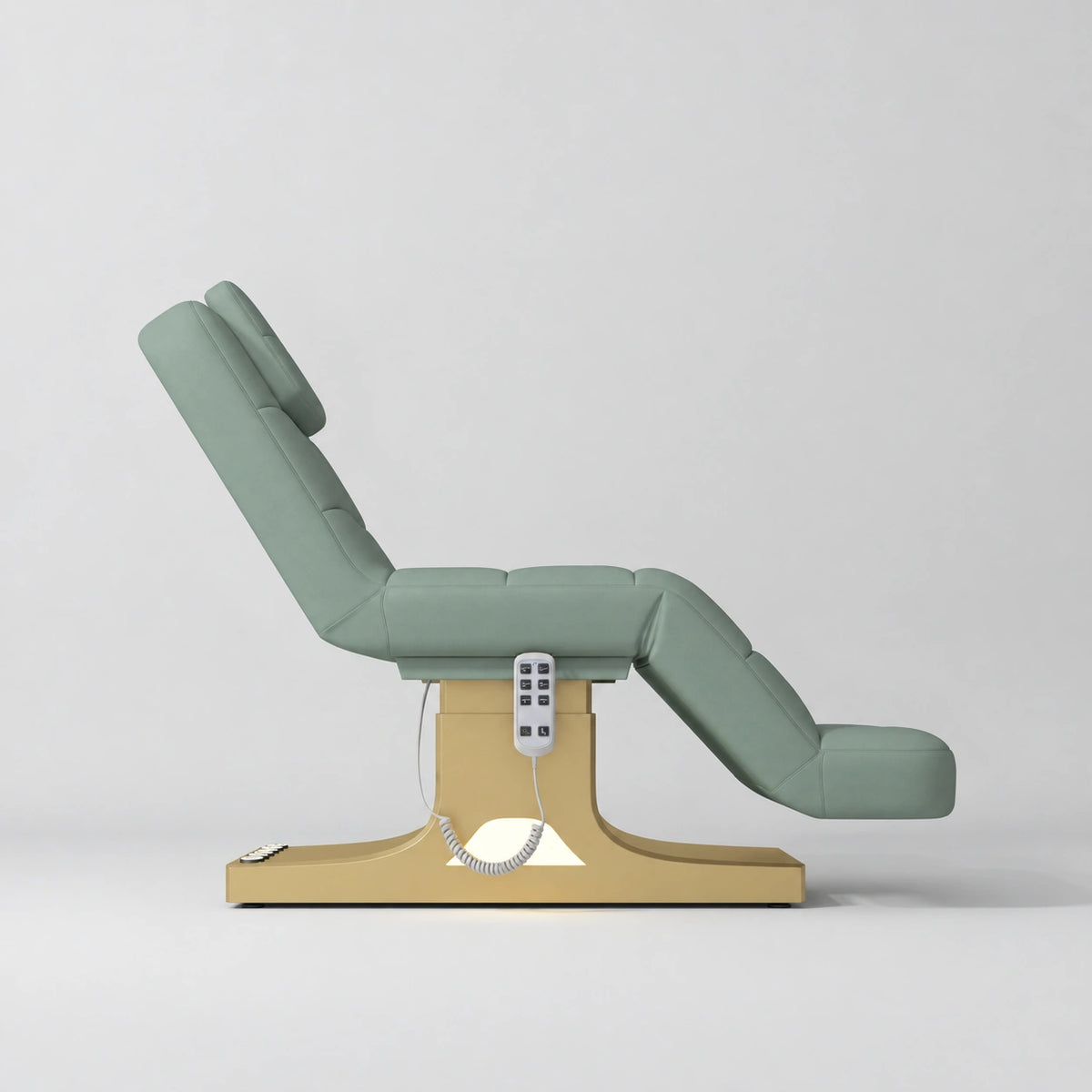 Manufakturo Saphir A Olive electric beauty bed with gold base, raised treatment position shown from the side, without armrests.