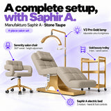 Manufakturo Saphir A Stone Taupe set features: three-motor bed with hand and foot controls, Serenity swivel chair, adjustable V3 Pro Gold lamp and three-tier gold trolley.