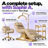 Manufakturo Saphir A Warm Beige set features: three-motor bed with hand and foot controls, Serenity swivel chair, adjustable V3 Pro Gold lamp and three-tier gold trolley.