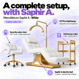 Manufakturo Saphir A White set features: three-motor bed with hand and foot controls, Serenity swivel chair, adjustable V3 Pro Gold lamp and three-tier gold trolley.