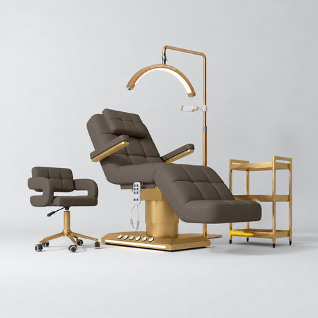 Manufakturo Saphir B Cocoa Mocha four-piece beauty studio set with armrest electric bed, Serenity salon chair, V3 Pro Gold lamp and empty three-tier gold trolley.