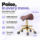 Manufakturo Selle Dusty Rose Gold Base saddle stool with gas-lift adjustment, footrest ring and five castors.
