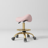 Manufakturo Selle Ergonomic Beauty Saddle Stool Bare Blush - Gold Base - close-up of the upholstery and construction details