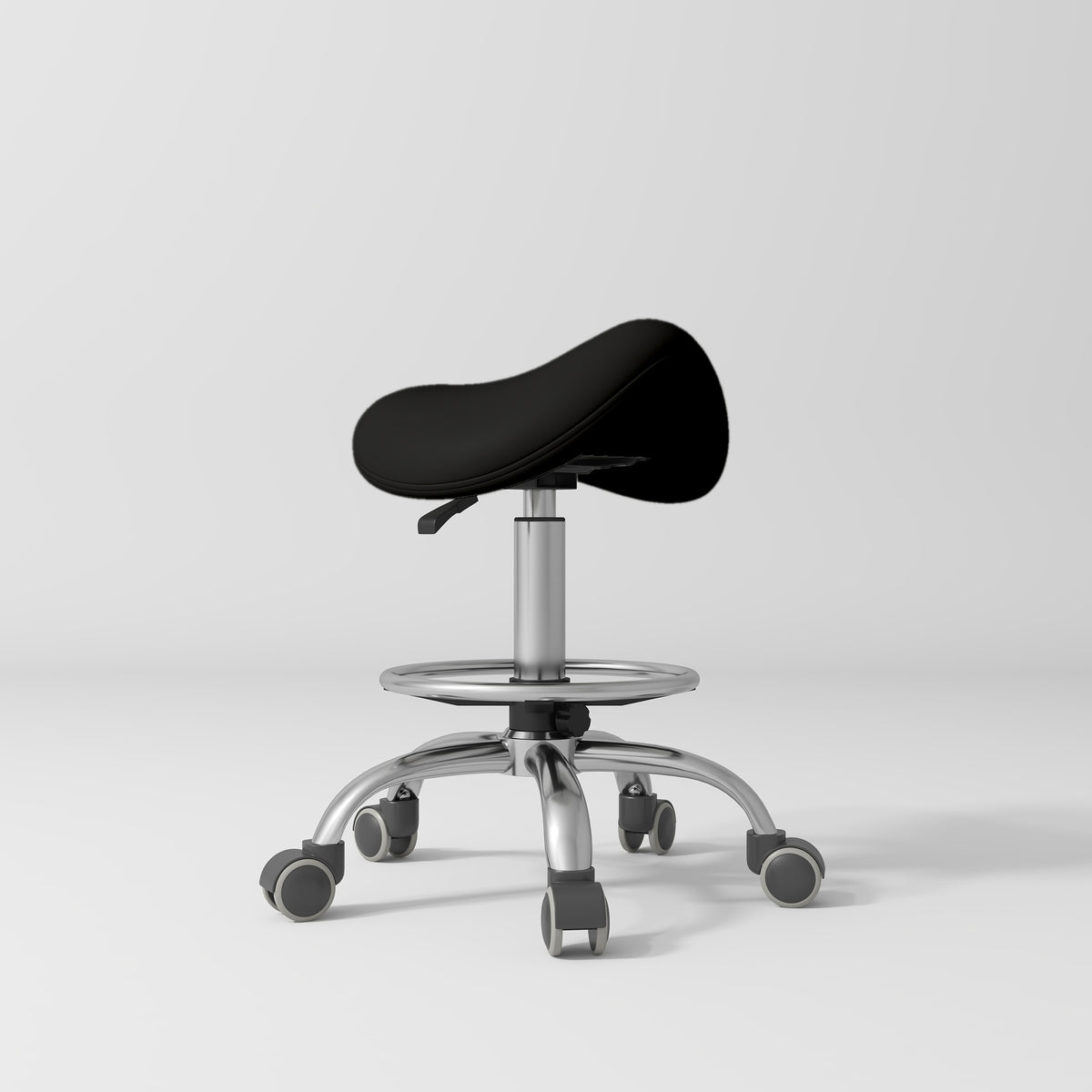 Manufakturo Selle Ergonomic Beauty Saddle Stool Black - Silver Base - displayed in a professional treatment-room setting