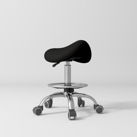 Manufakturo Selle Ergonomic Beauty Saddle Stool Black - Silver Base - displayed in a professional treatment-room setting