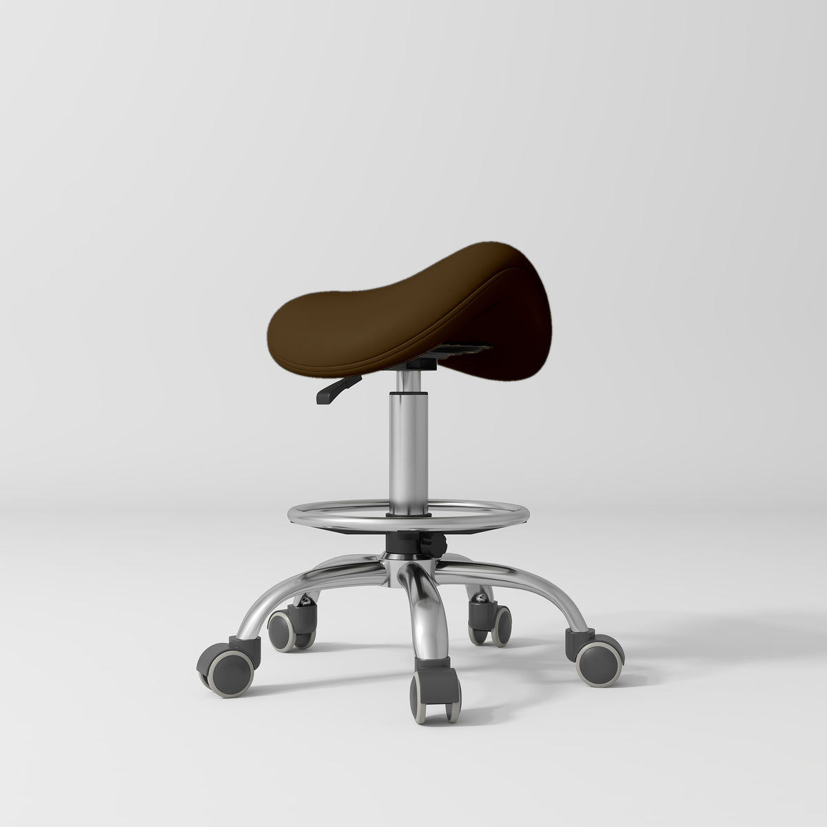 Manufakturo Selle Ergonomic Beauty Saddle Stool Cocoa Mocha - Silver Base - displayed in a professional treatment-room setting