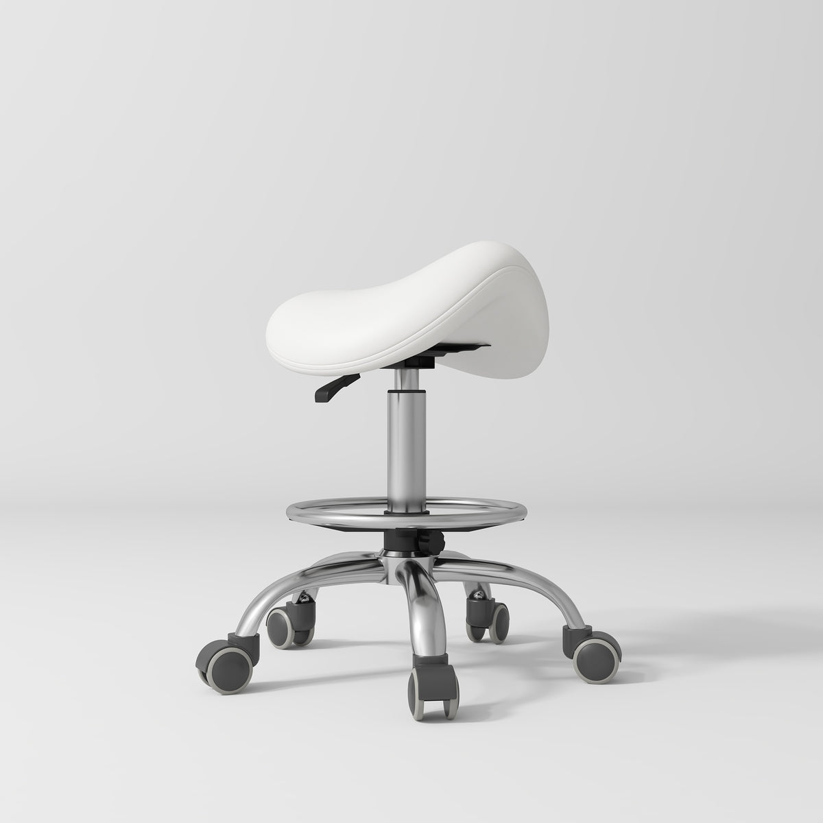 Manufakturo Selle Ergonomic Beauty Saddle Stool White - Silver Base - displayed in a professional treatment-room setting