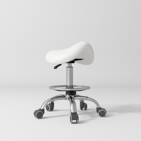 Manufakturo Selle Ergonomic Beauty Saddle Stool White - Silver Base - displayed in a professional treatment-room setting