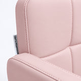 Close-up of Manufakturo Serenity Bare Blush salon chair upholstery, showing the stitched padded backrest, armrest piping and woven Manufakturo label.
