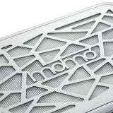 Close-up of the silver Momo logo and geometric metal intake grille on the P35 dust collector
