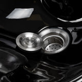Open drain plug revealing the built-in strainer in the Omega Aqualina basin