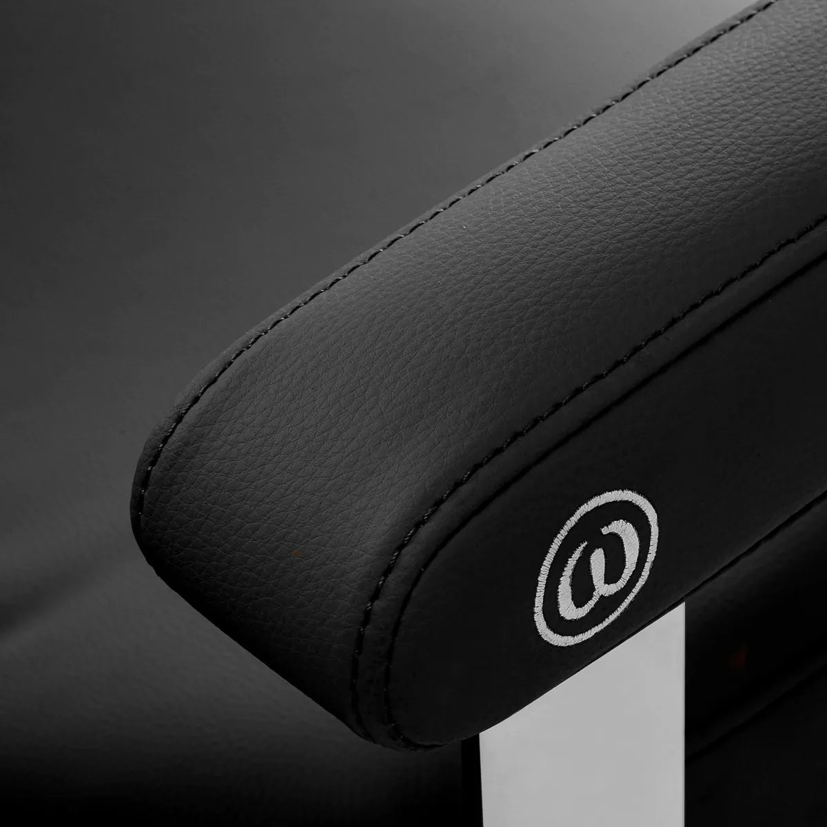 Omega Hairdressing Chair Astra Plus Black - close-up of the upholstery and construction details