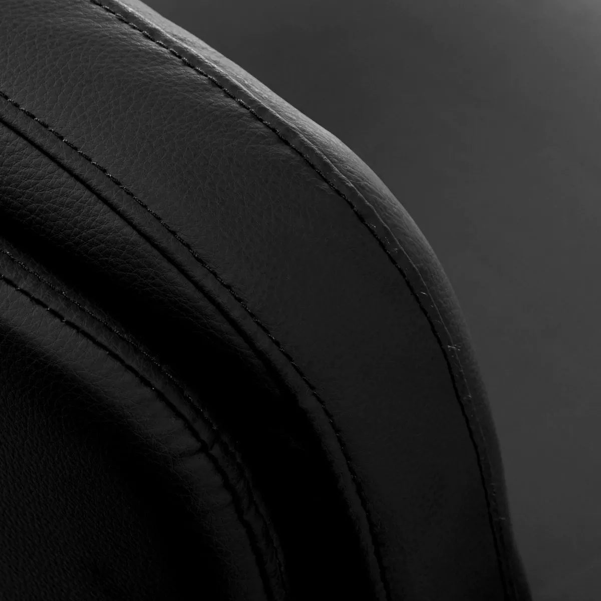 Omega Hairdressing Chair Astra Plus Black - close-up of the upholstery and construction details