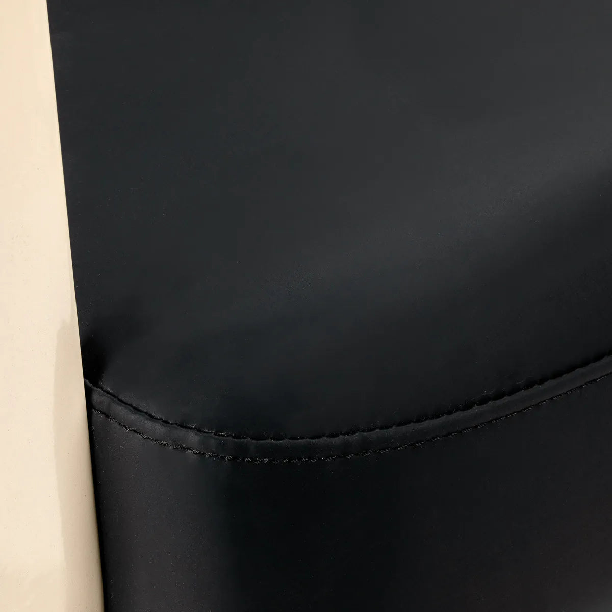 Omega Hairdressing Chair Aurora Black - close-up of the upholstery and construction details