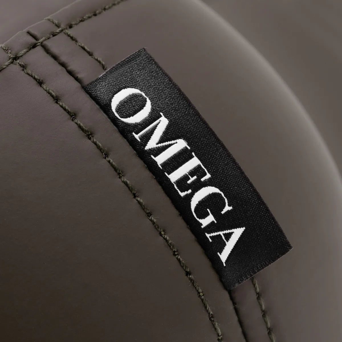 Omega Supremo Swivel Stool Brown & Silver - close-up of the upholstery and construction details