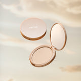 Paese Puff Cloud Pressed Face Powder - finished result shown on a model's face