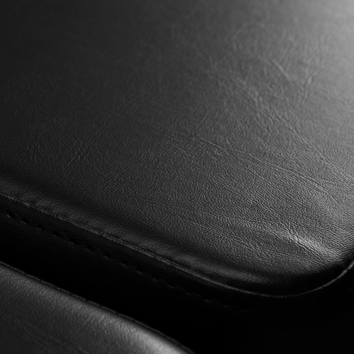 Pro Ink 610 Electric Tattoo Bed Black - close-up of the upholstery and construction details