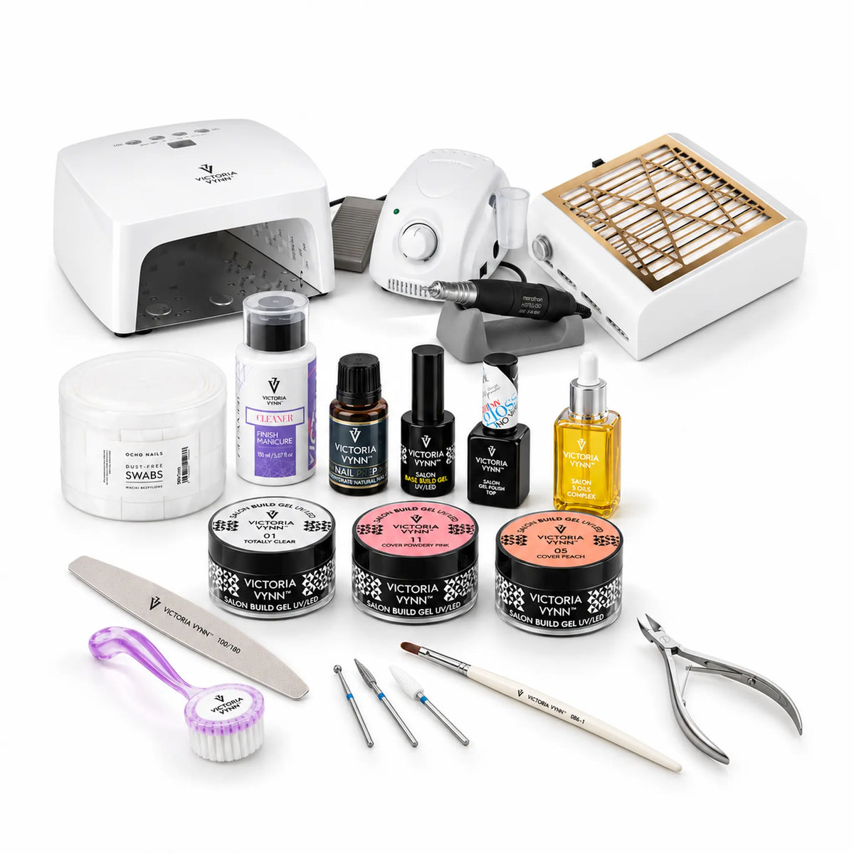 A nail art and manicure kit arranged on a white background, including a UV lamp, electric nail grinder, nail file, brush, cuticle tools, bottles of gel polish, and jars of press-on nails.