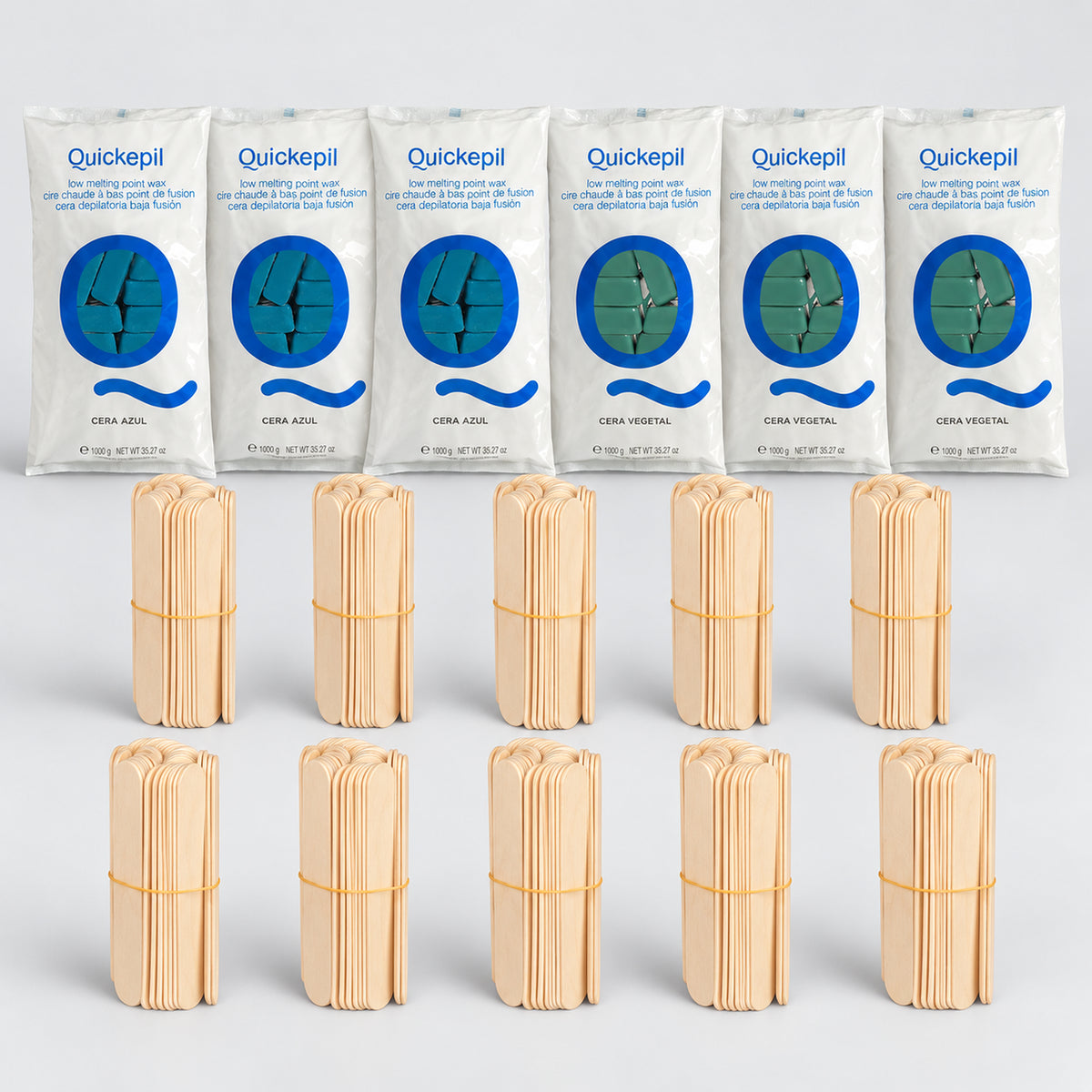 Six 1kg Quickepil hard wax packs, three Blue and three Green, with ten bundles of 50 large wooden spatulas.