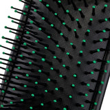 Roxie Cosmetics Black Pneumatic Hair Brush - product displayed with its packaging on a dark background