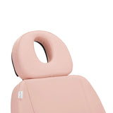 Close-up of the headrest with an open face cutout on the Sillon Electric Cosmetic Chair Classic in pink for spa treatments.
