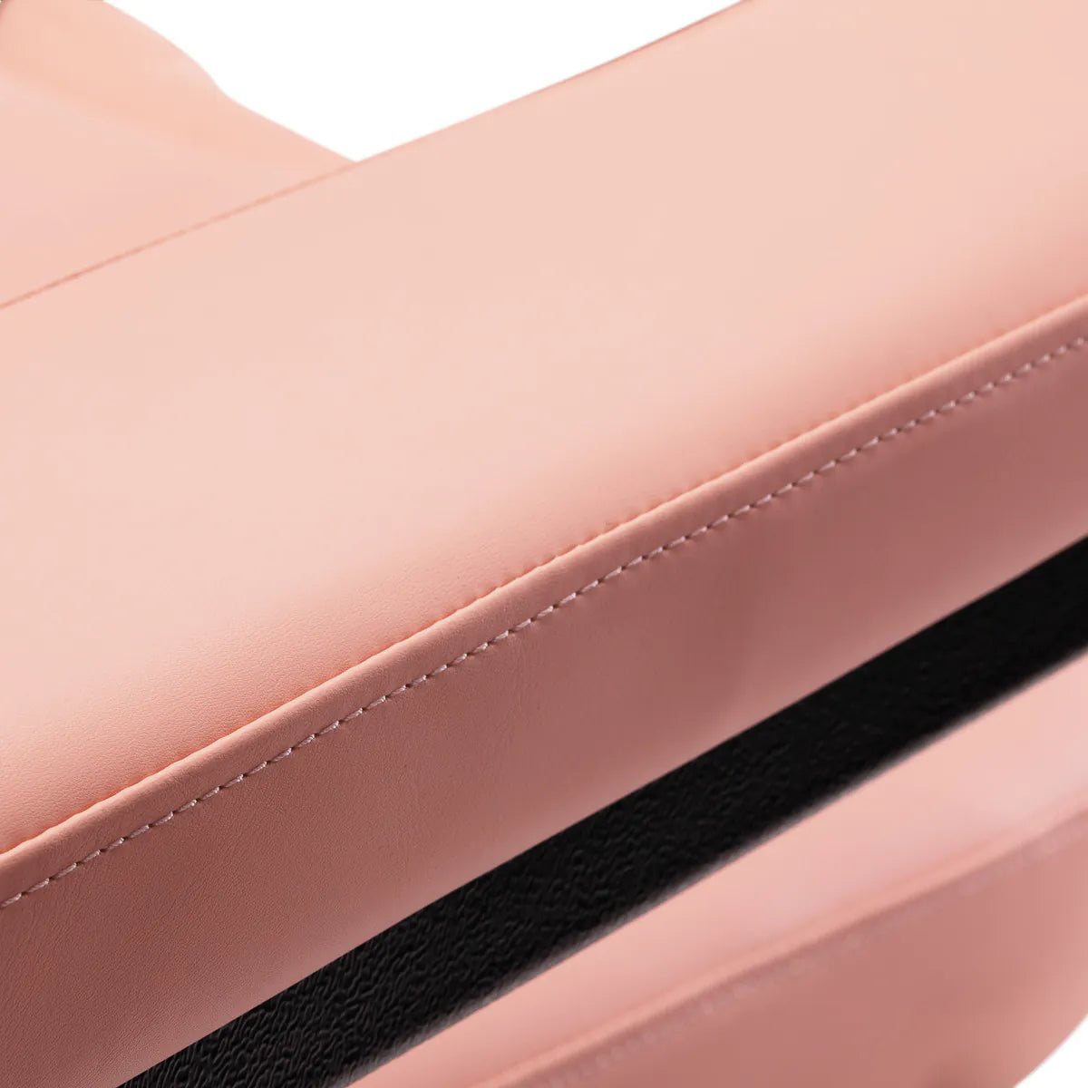 Detailed view of the armrest stitching on the Sillon Electric Cosmetic Chair Classic in pink, highlighting premium craftsmanship.