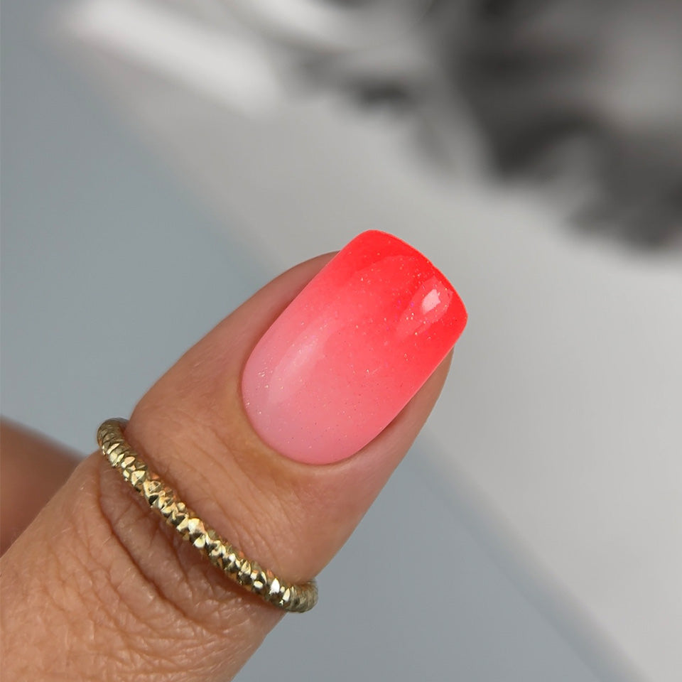 Slowianka Baby Boomer in Spray Coral Neon - product colour and packaging on a dark background
