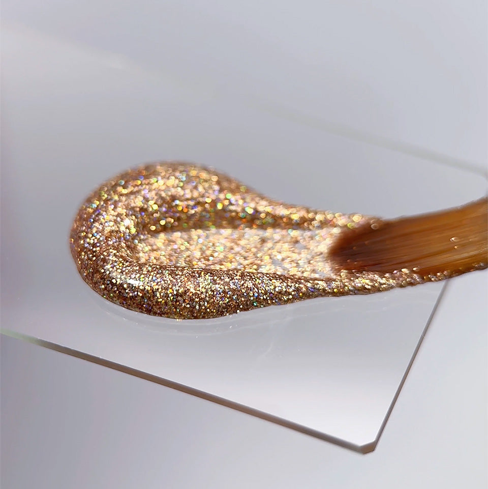 Slowianka Tiny Gold Holo Decoration Powder Dust - product colour and packaging on a dark background