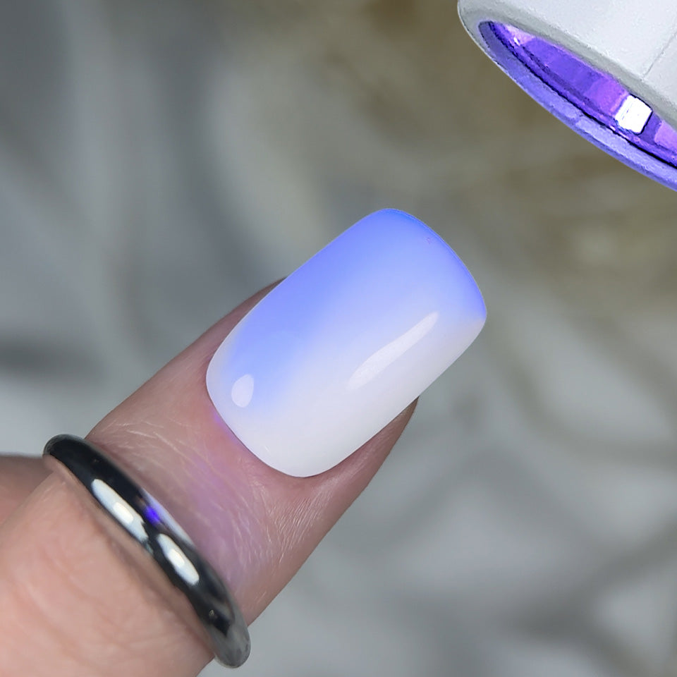Slowianka Top Coat Gloss Pro White Defense - product colour and packaging on a dark background