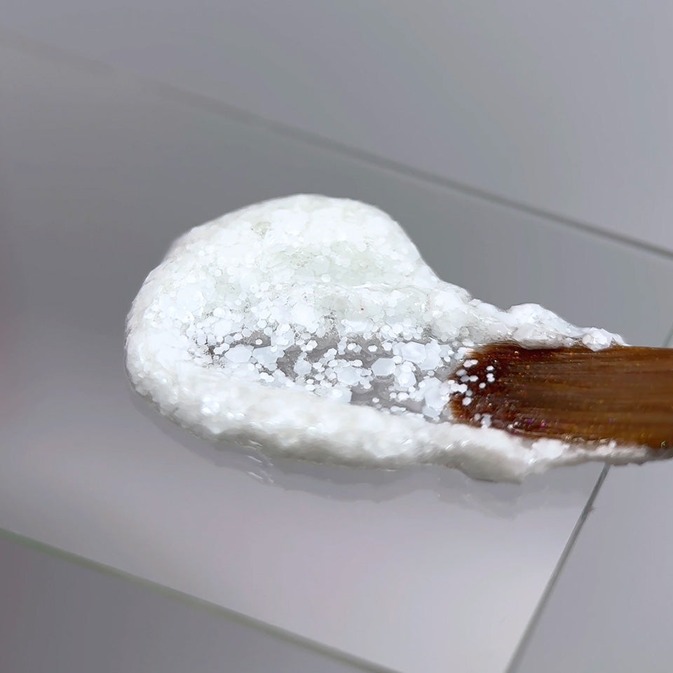 Slowianka White Snow Decoration Powder Dust - product colour and packaging on a dark background