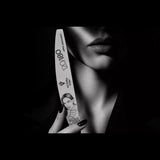 Victoria Vynn APEX ARCHITECT 120/180 crescent nail file held in a monochrome salon image