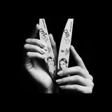 Victoria Vynn APEX ARCHITECT and Detail Queen crescent nail files held in a monochrome lifestyle view