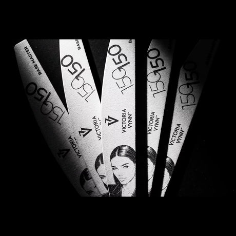 Fan arrangement of Victoria Vynn Base Master 150/150 crescent nail files on a black background