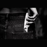 Victoria Vynn Client Whisperer 120/150 crescent nail file held in a monochrome lifestyle view