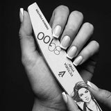 Victoria Vynn French Fighter 80/100 crescent nail file held beside a finished French manicure